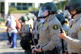 Police at a BLM protest in La Mesa Saturday, 08/01/2020. photo by Bill Wechter