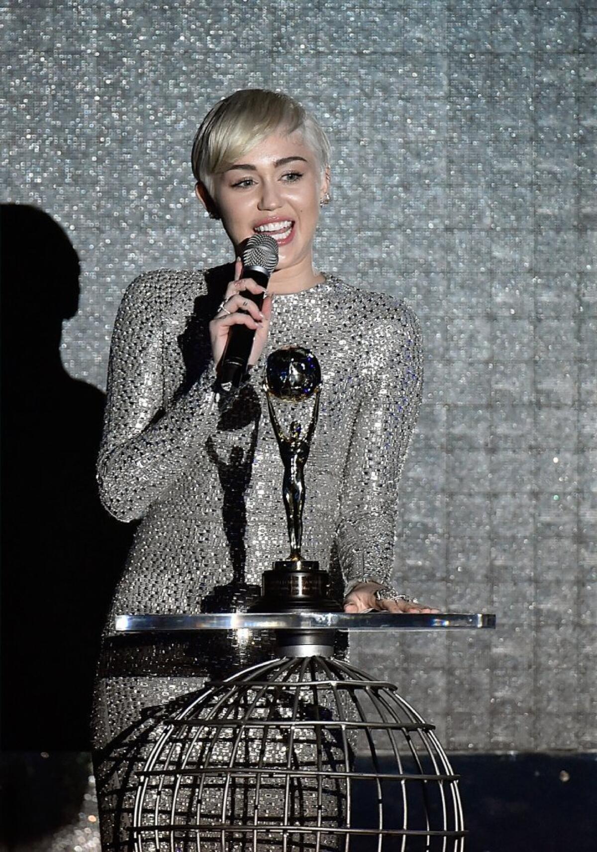 Miley Cyrus receives an award during the ceremony of the 2014 World Music Awards in Monte Carlo, Monaco.