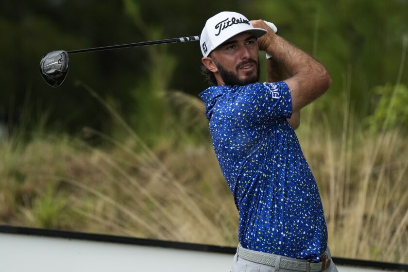 Max Homa, of the United States, watches his shot on the 10th tee during a practice round of the Hero World Challenge PGA Tour at the Albany Golf Club, in New Providence, Bahamas, Wednesday, Nov. 30, 2022. (AP Photo/Fernando Llano)