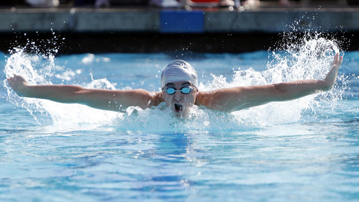 Newport Harbor High's Nick Halphide competes in the boys' 100-yard butterfly race against Edison in Sunset League swim meet in Newport Beach on Tuesday, April 10.