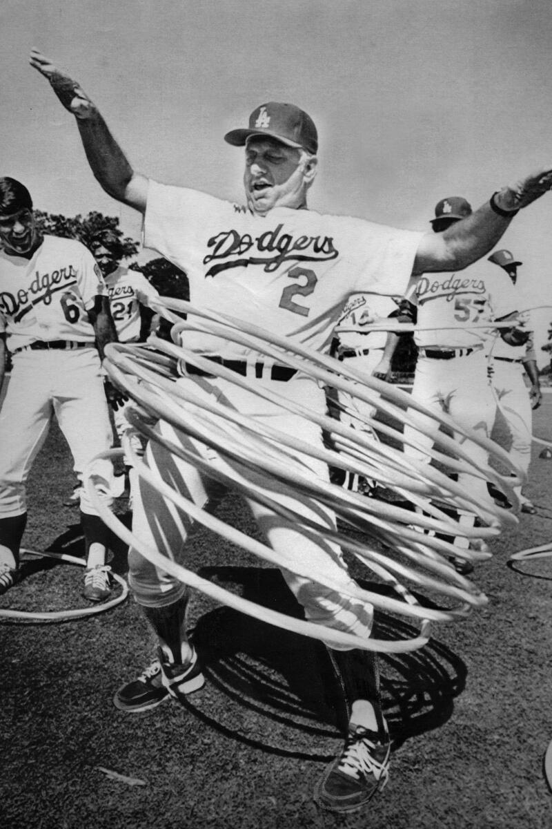 =Los Angeles Dodgers Manager Tommy Lasorda tries nine hula hoops.