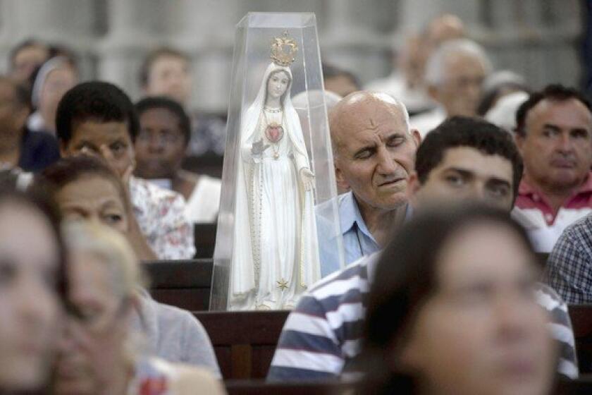 Worshipers gather Friday in Sao Paulo, Brazil, for a special Mass in honor of outgoing Pope Benedict XVI. Nineteen cardinals from Latin America are expected to be among those who will choose Benedict's successor.