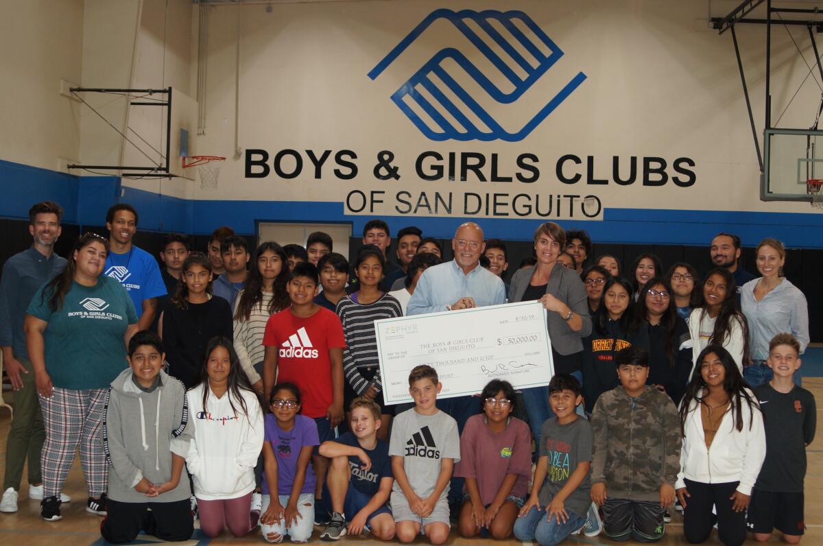 Zephyr Foundation Executive Vice President Jim McMenamin presented their $50,000 donation to Boys & Girls Clubs of San Dieguito CEO Marineke Vandervort at the Harper Branch on Aug. 30.