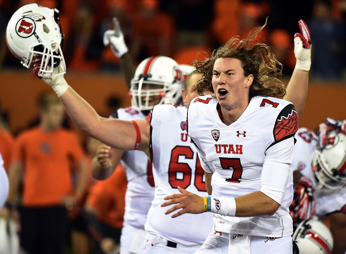 Utah quarterback Travis Wilson #7 celebrates as he runs off the field after the Utes beat Oregon State in double overtime on Oct. 16.