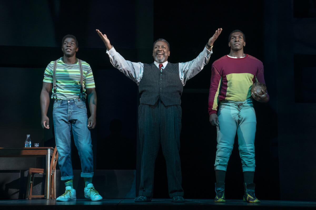 This image released by DKC/O&M shows McKinley Belcher, from left, Wendell Pierce and Khris Davis during a performance of Arthur Miller’s “Death of a Salesman” in New York. (Joan Marcus/DKC/O&M via AP)
