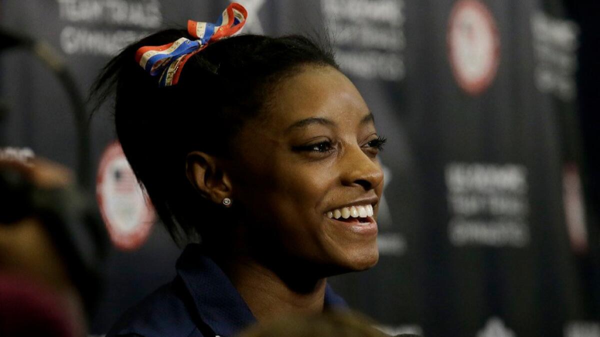 Simone Biles smiles during interviews after a practice for the U.S Olympics gymnastics trials on July 7.