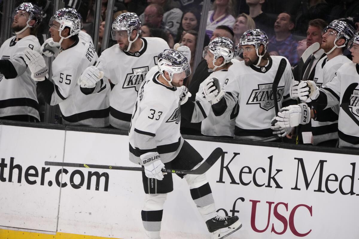 The Kings' Viktor Arvidsson (33) celebrates his goal with teammates during the first period March 25, 2023.