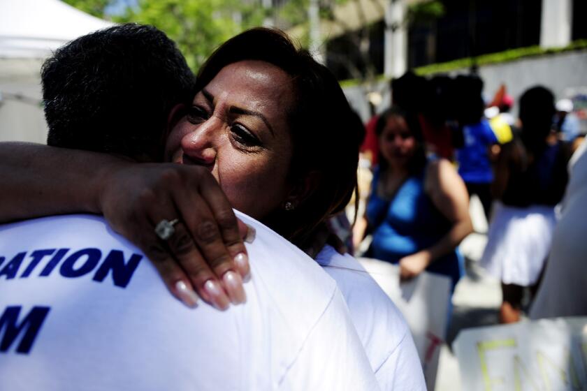 Maria Galvan hugs her husband, Luis Barajas, at the conclusion of a 24-hour vigil in Los Angeles after the Senate passed an immigration reform bill June 27. The pair reside in the country illegally.