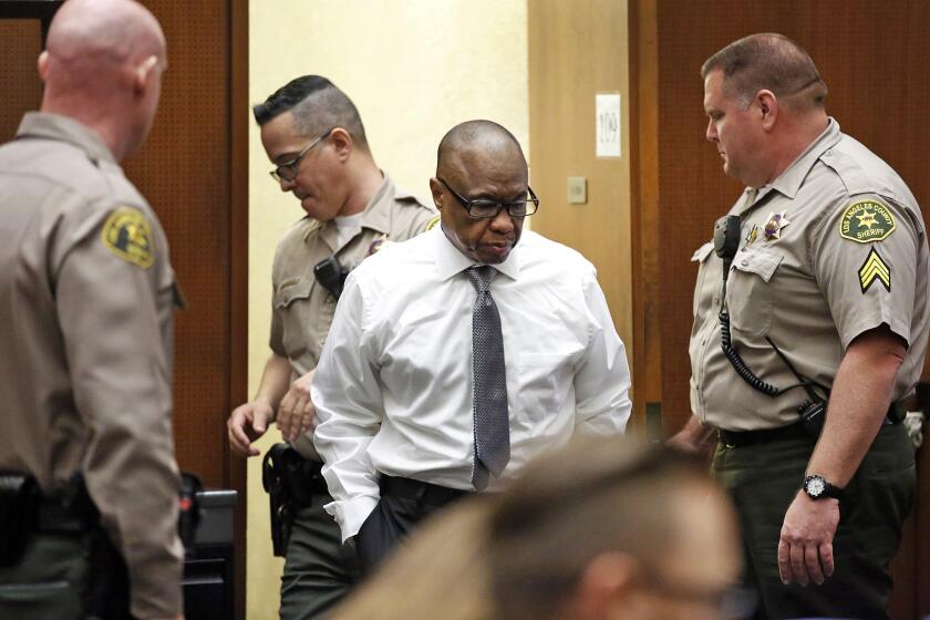 Lonnie Franklin Jr. enters the courtroom early in his murder trial. Franklin is charged with the so-called Grim Sleeper killings that terrorized South L.A. over more than two decades.