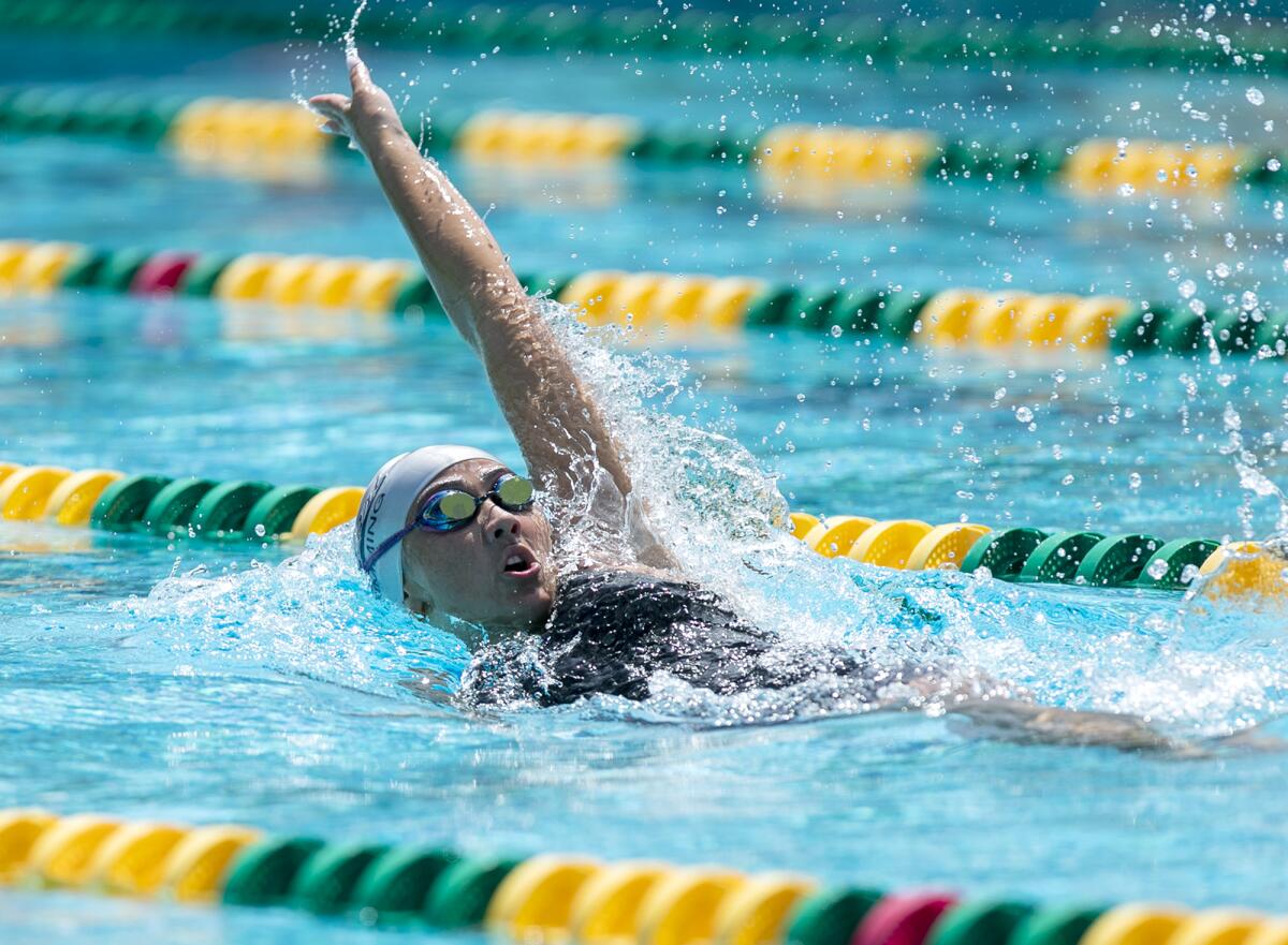 Newport Harbor's Ariana Amoroso swims the first leg of the girls' 200-yard medley relay on Thursday.