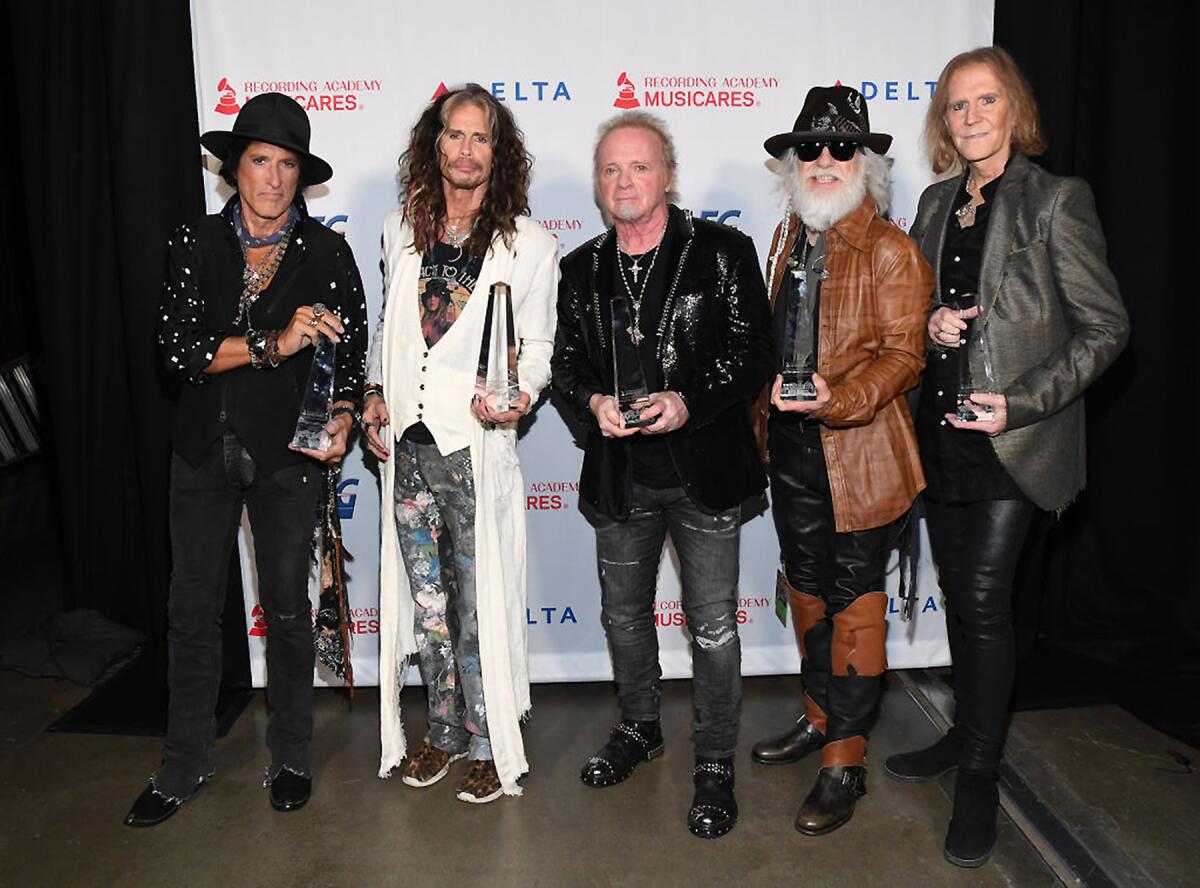 Honorees Joe Perry, Steven Tyler, Joey Kramer, Brad Whitford, and Tom Hamilton of music group Aerosmith, recipients of the Person of the Year award, attends MusiCares Person of the Year honoring Aerosmith at West Hall at Los Angeles Convention Center on January 24, 2020 in Los Angeles, California.