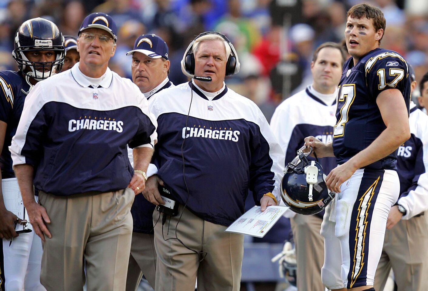 Chargers coach Marty Schottenheimer, Wade Phillips, and Philip Rivers look at video board after play against the Chiefs at Qualcomm Stadium on Jan. 2, 2005.