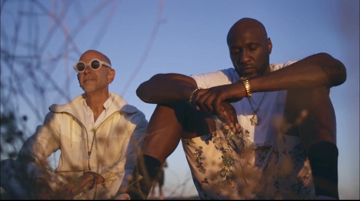 Mike 'Zappy' Zapolin, left, sits with NBA champion Lamar Odom.