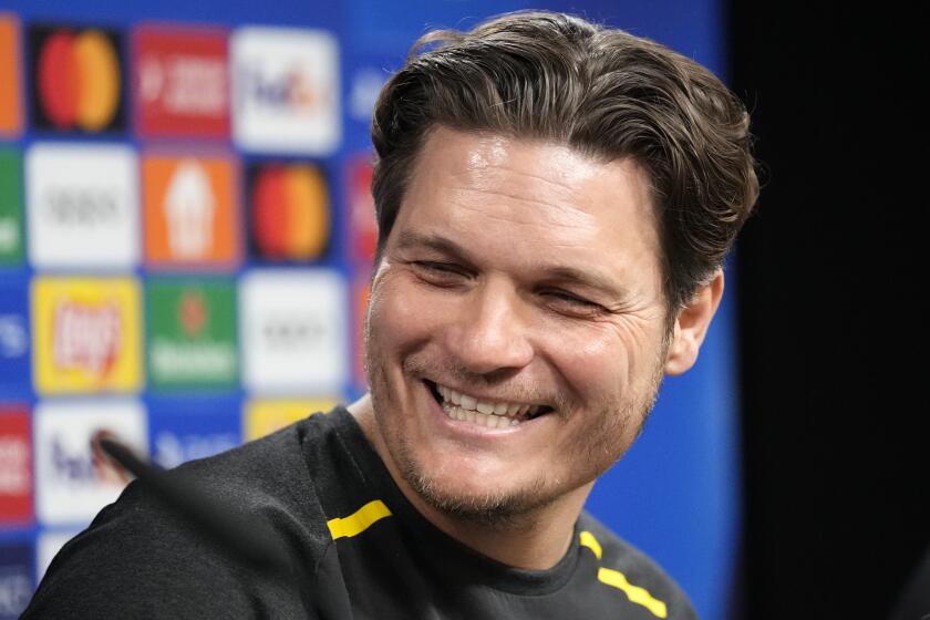 Dortmund's head coach Edin Terzic smiles at a press conference prior the Champions League semifinal first leg soccer match between Borussia Dortmund and Paris Saint-Germain at the Signal-Iduna Park in Dortmund, Germany, Tuesday, April 30, 2024. (AP Photo/Martin Meissner)