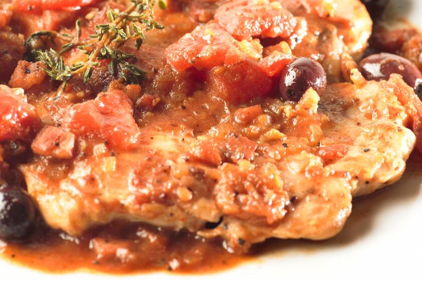 Chicken breasts are topped with a sauce of tomatoes, olives, herbs and rich pancetta. Recipe: Basque-style chicken