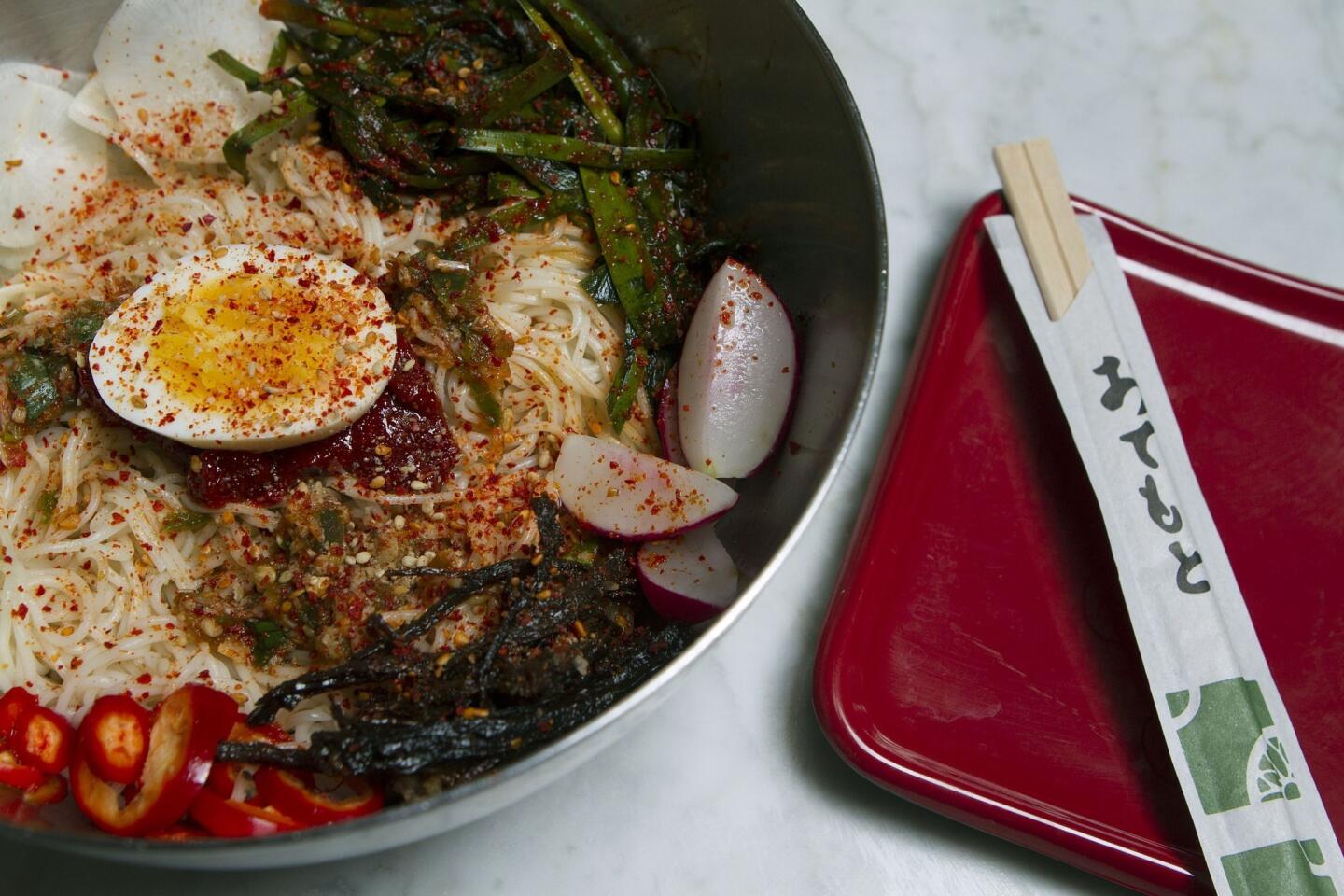 Pot offers a "noodle of the day." This day's offering comes with chilled noodles, various raw and pickled vegetables, chile paste, shredded beef and a hard-boiled egg.