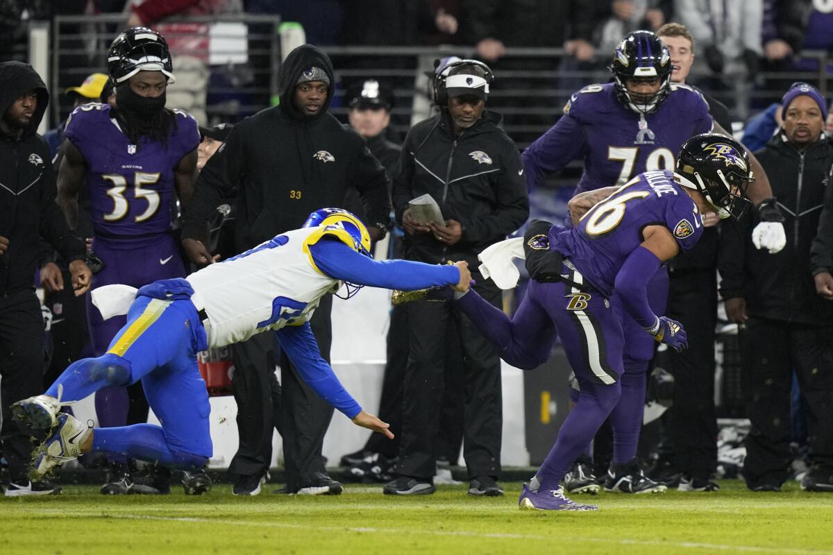 The Ravens' Tylan Wallace breaks free for the deciding 76-yard punt return for a touchdown in overtime against the Rams.