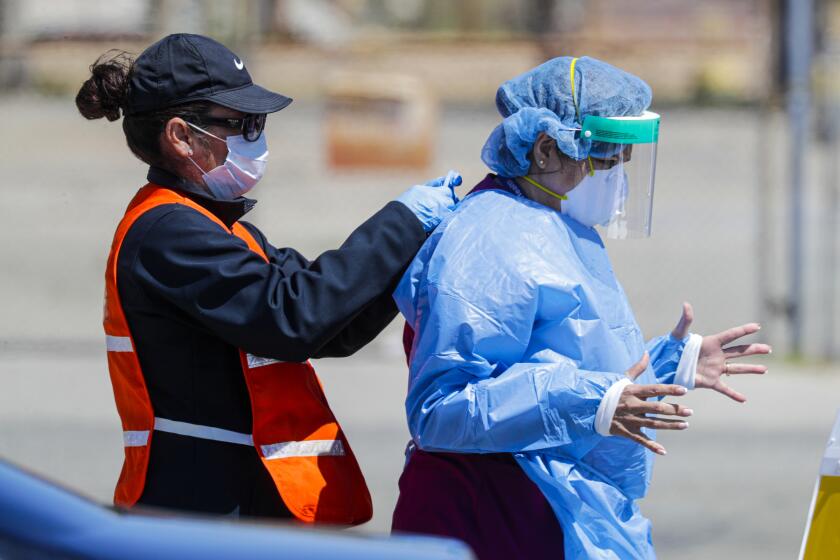 VICTORVILLE, CA - APRIL 02, 2020 -Coronavirus COVID-19 drive-thru sample collection takes place at the county fairgrounds on Thursday April 02, 2020, Victorville. (Irfan Khan / Los Angeles Times)
