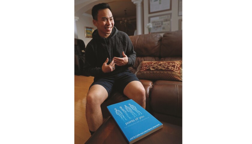 Young entrepreneur, and now author, Vick Liu, in his family home in Arcadia on Monday. Liu, with three other authors, wrote a 15-chapter book that wrestles with tales of depression, lack of purpose and relationships.
