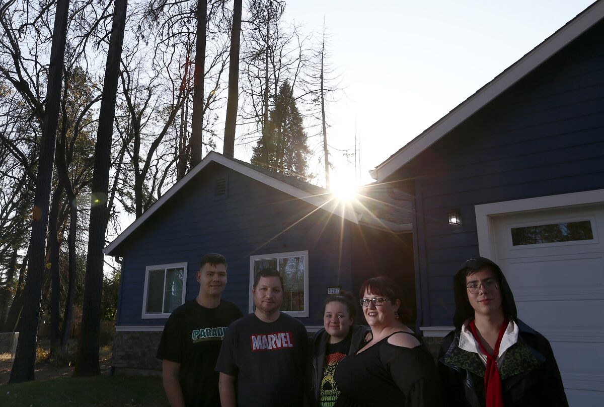 Victoria Sinclaire, second from right, and her family rebuilt their home in Paradise, Calif.