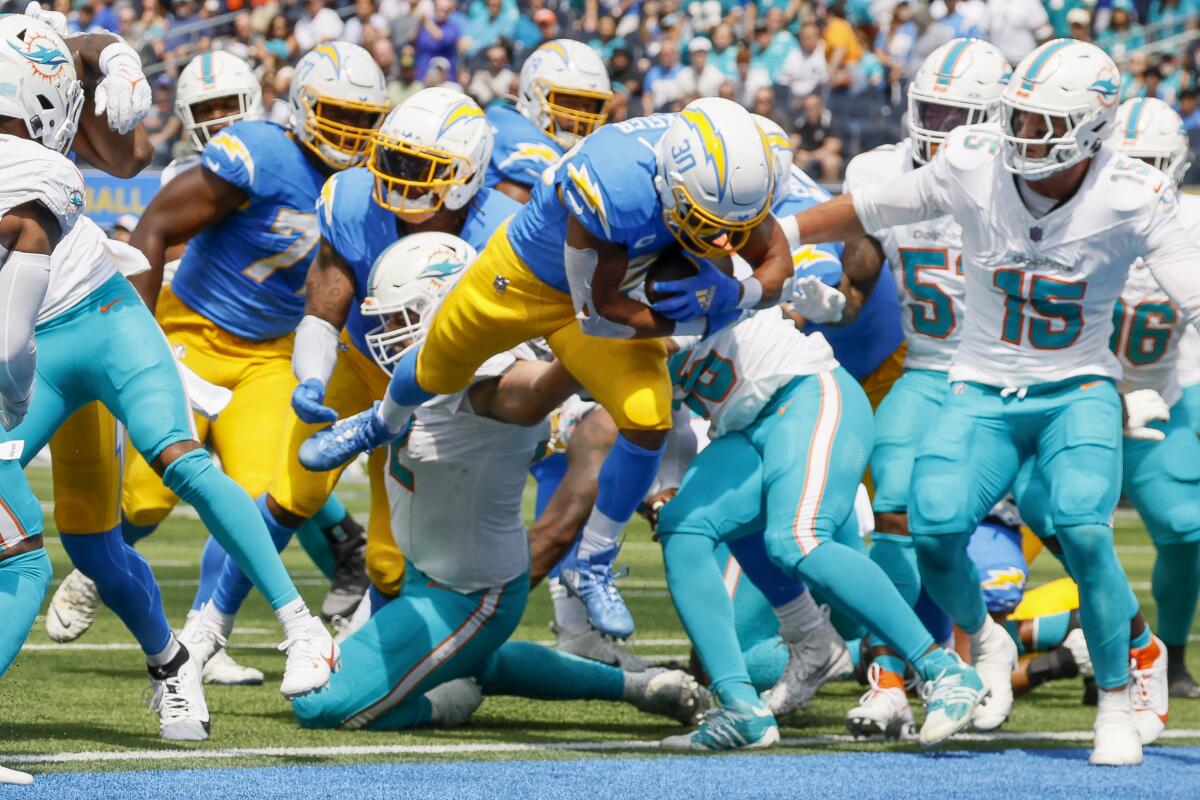 The  Chargers' Austin Ekeler runs for a touchdown against the Dolphins in the season opener.