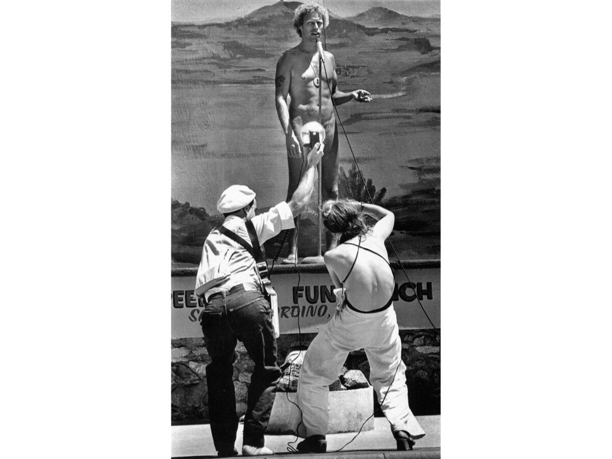 July 13, 1980: Photographers crowd around to capture the naked truth as Jerry Kinley makes his bid for the Mr. Nude International-U.S.A. title. He was chosen as second runner-up.