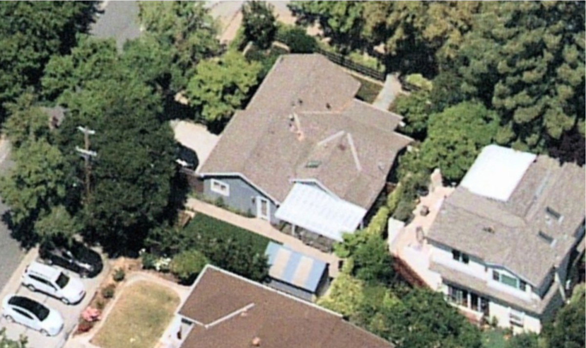 The bird's eye view of the single-story home, grounds and surrounding homes.
