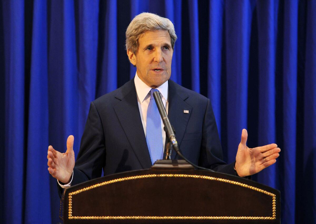 U.S. Secretary of State John F. Kerry speaks Friday during a news conference in Amman, Jordan, saying that Israeli and Palestinian negotiators will meet next week in Washington.