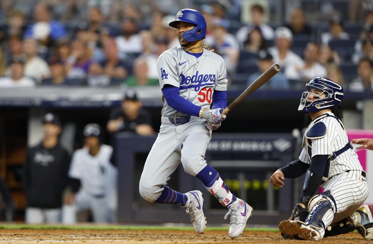 Dodgers' Mookie Betts hits a double against the New York Yankees.