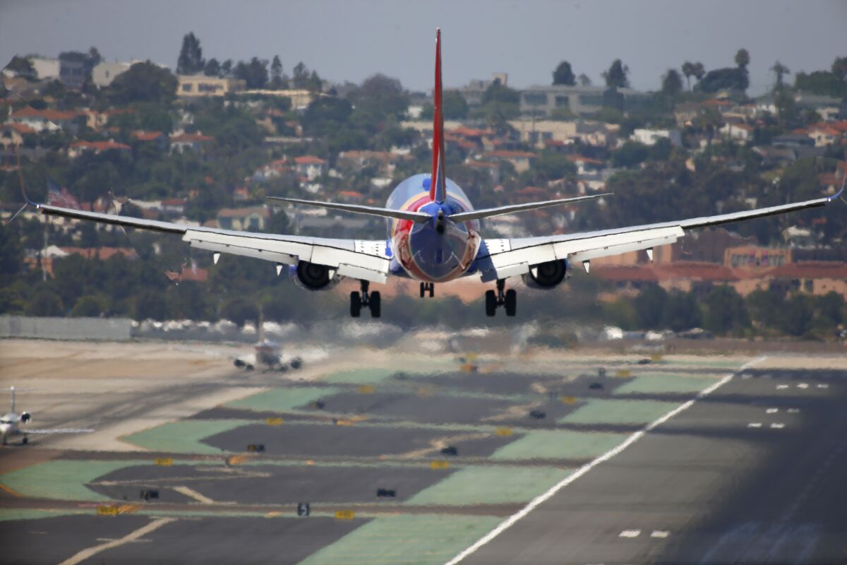 A Southwest Airlines jet comes in for a landing at San Diego International Airport.