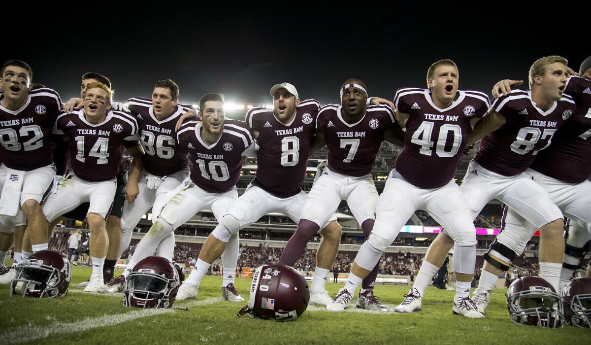 Texas A&M's Trevor Knight (8) sways along with teammates during the singing of the Aggie War Hymn after the team's 52-10 win over New Mexico State last Saturday.