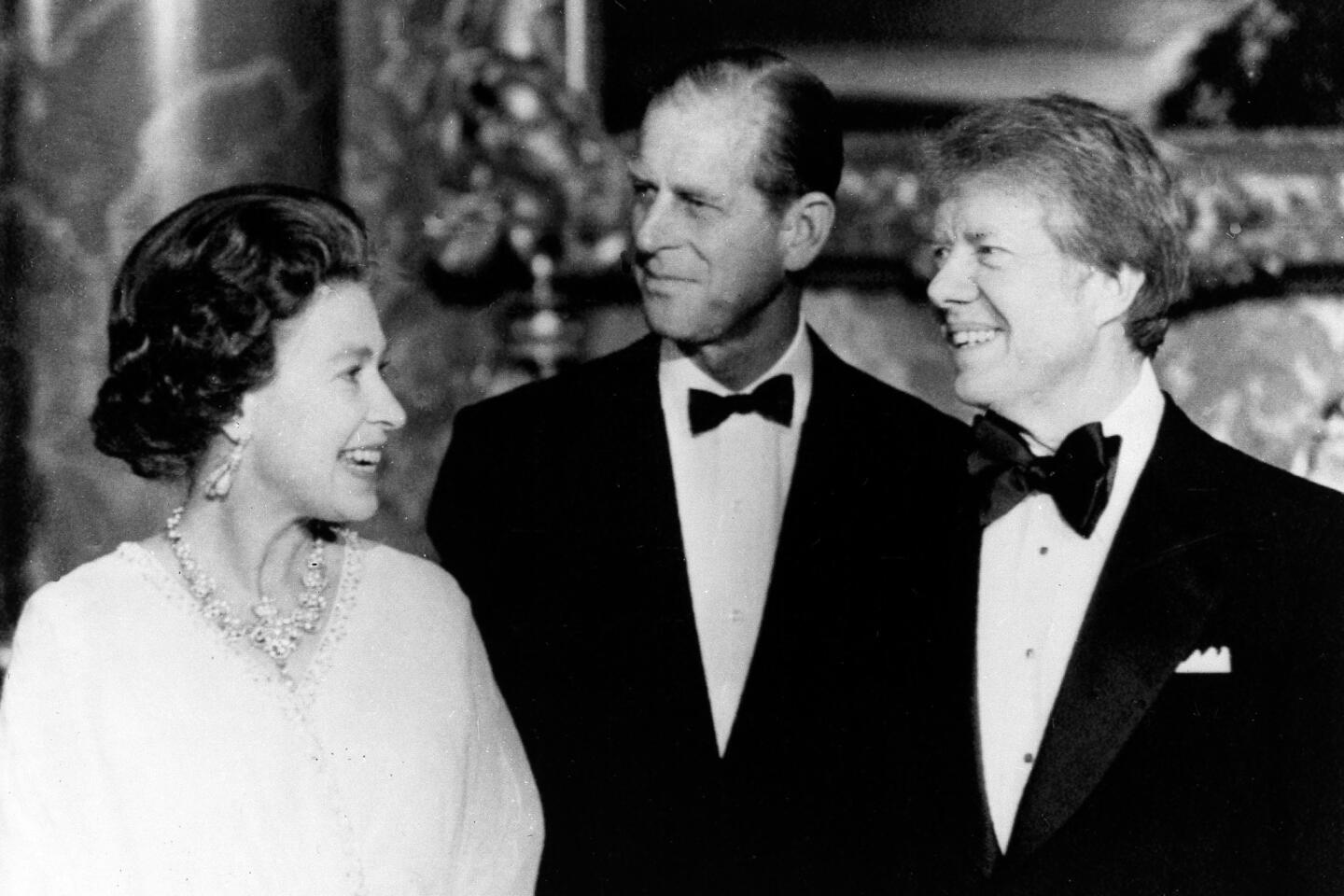 President Carter in May 1977 with Queen Elizabeth II and Prince Philip at Buckingham Palace.