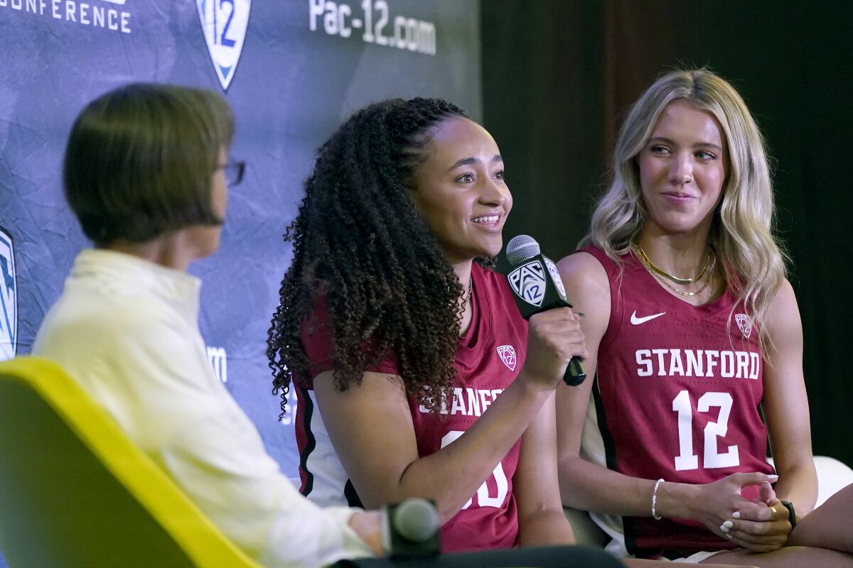 Stanford head coach Tara VanDerveer, left, listens as Haley Jones, center, speaks next to Lexie Hull during an NCAA college basketball news conference at the Pac-12 Conference media day Tuesday, Oct. 12, 2021, in San Francisco. (AP Photo/Jeff Chiu)