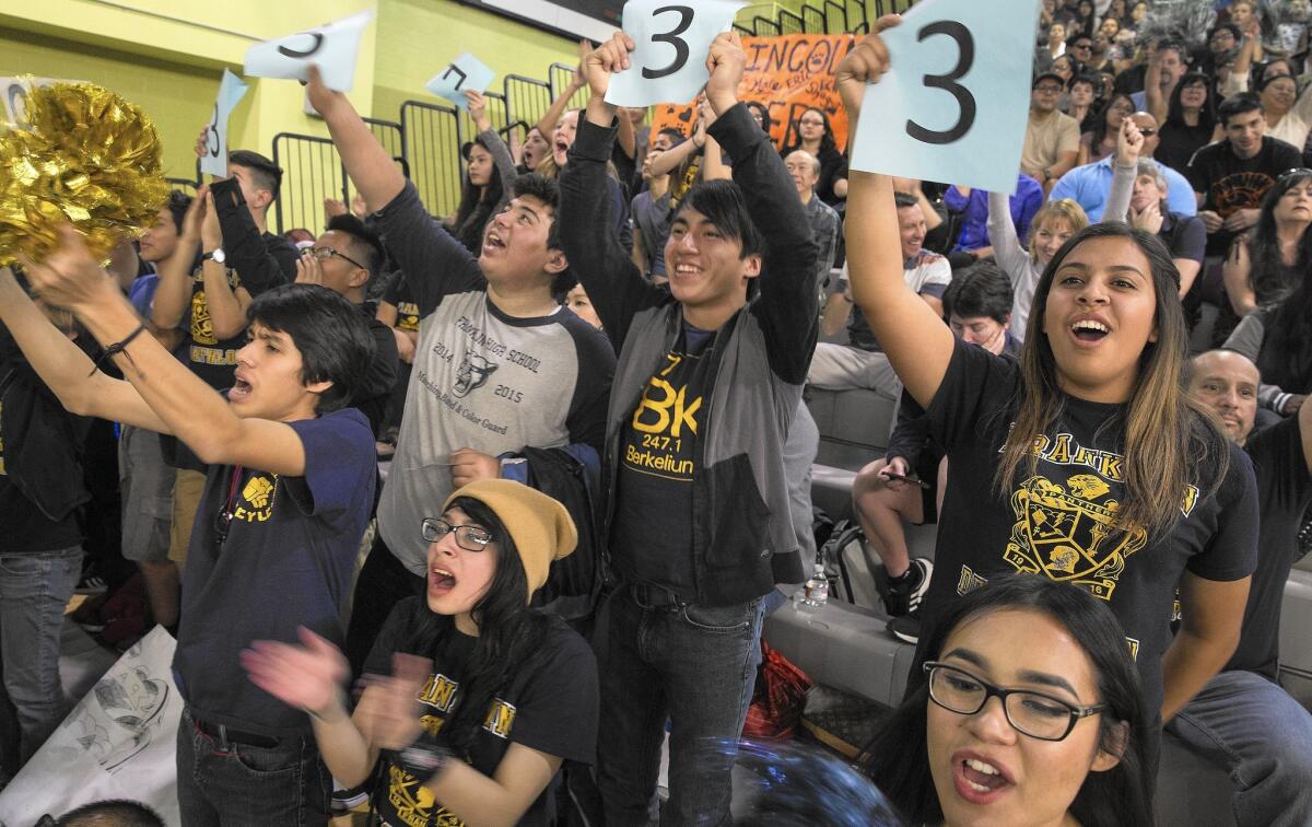 Franklin High School students cheer their team in the academic decathlon known as the Super Quiz.