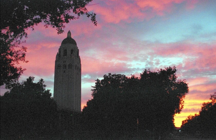 The sun sets on the Stanford campus.