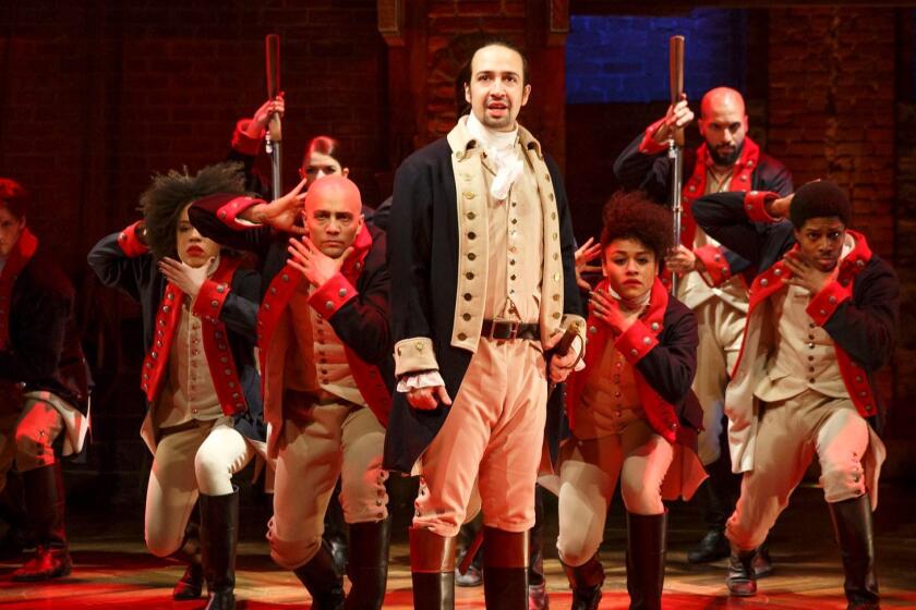 Lin-Manuel Miranda, foreground, performs with members of the cast of the musical "Hamilton" in New York.