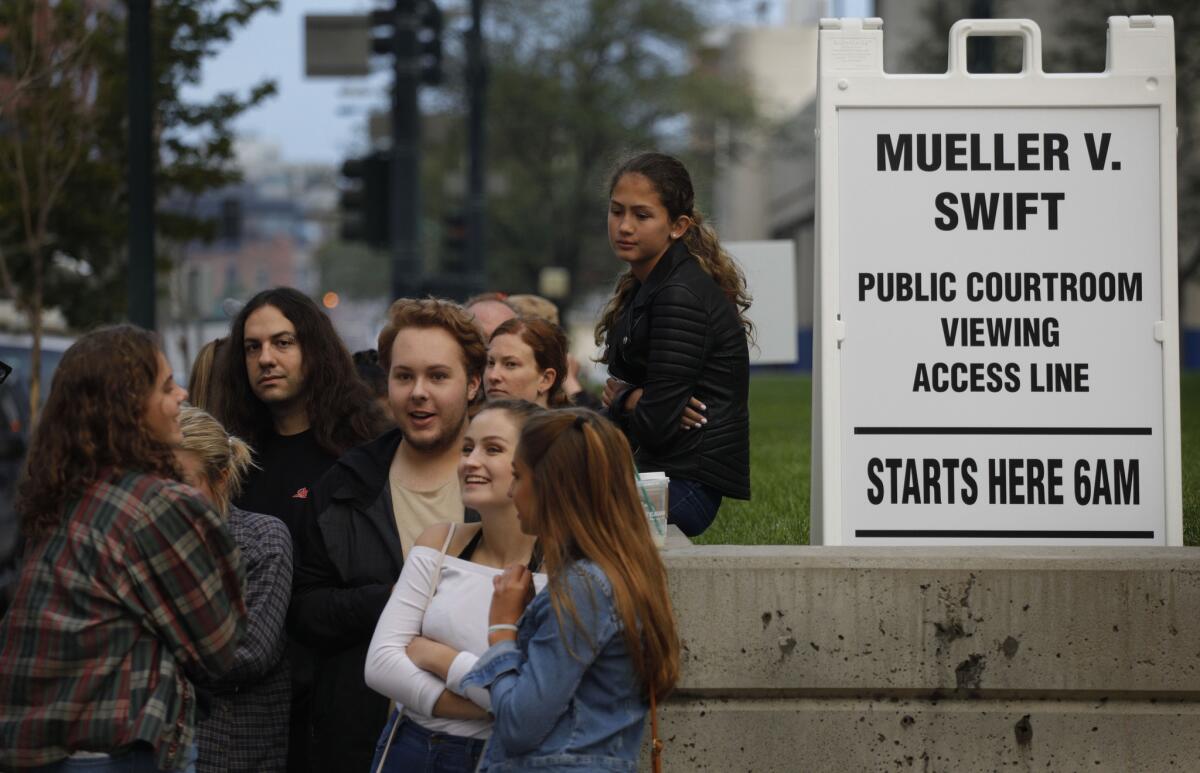 People wait in line to attend Taylor Swift's civil case at the Alfred A. Arraj Courthouse in Denver on Tuesday.