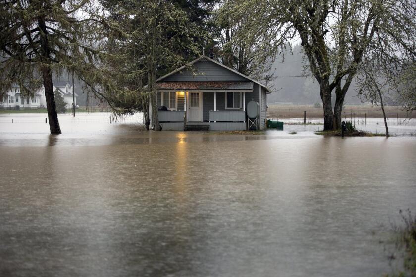 A home is flooded along Oregon 47 from the Nehalem River on Wednesday.