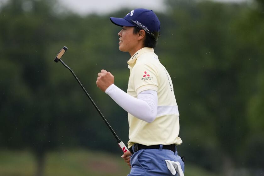 Yuka Saso, of Japan, reacts on the 18th green during the final round of the U.S. Women's Open.