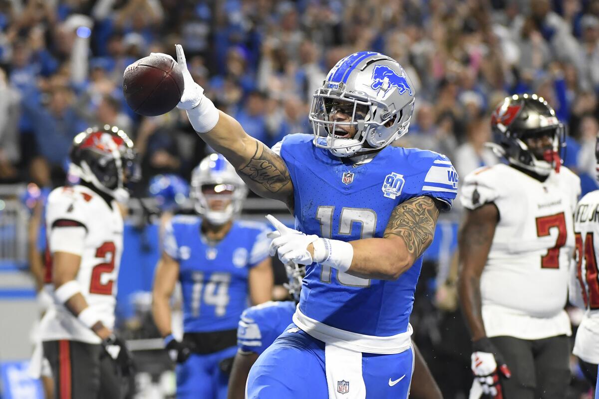 Detroit Lions running back Craig Reynolds celebrates after scoring a touchdown against the Tampa Bay Buccaneers.