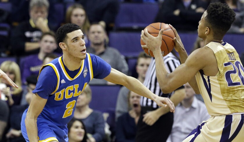 UCLA's Lonzo Ball (2) plays defense against Washington's Markelle Fultz during a game on Saturday.