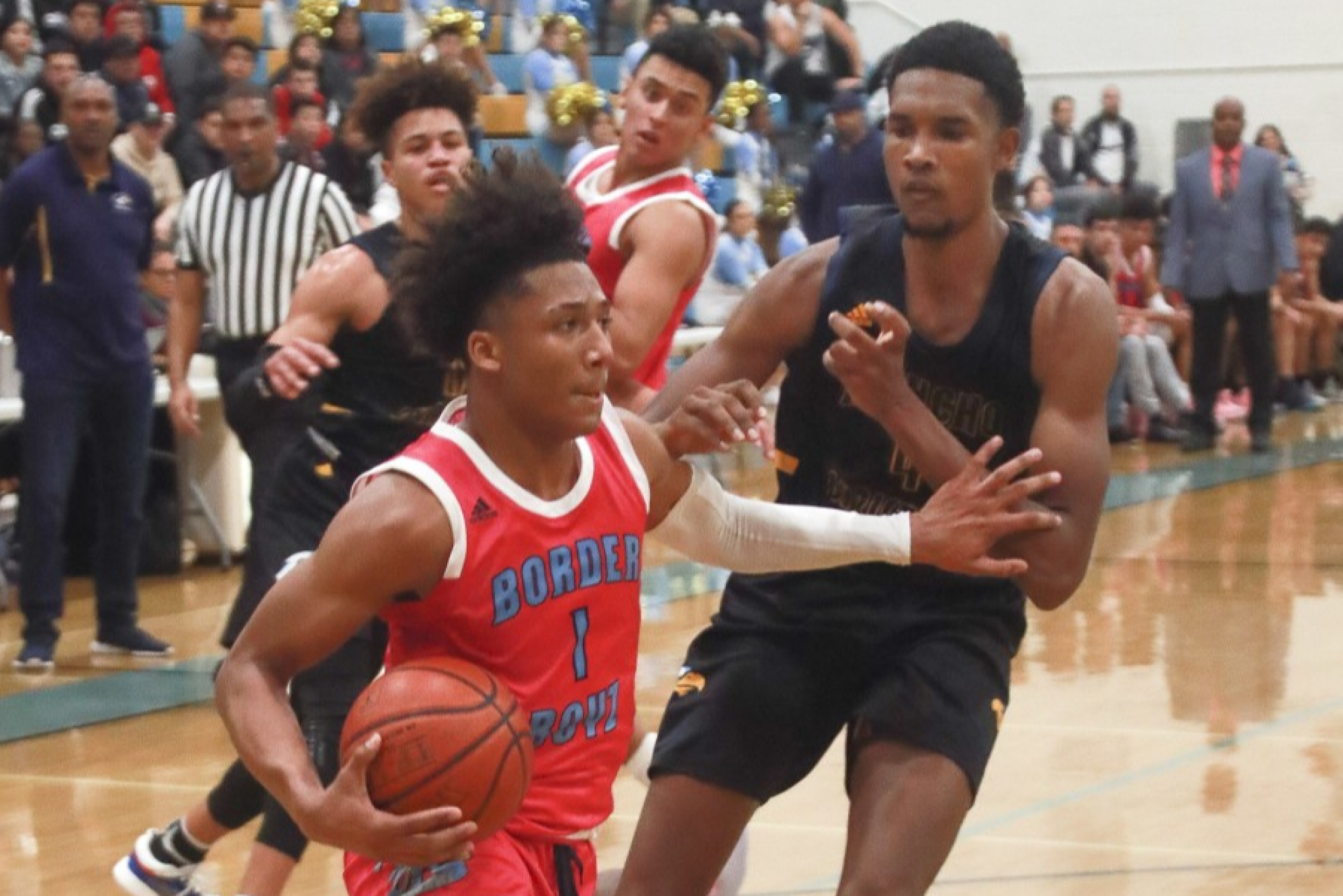 Evan Mobley defends San Ysidro’s Mikey Williams while playing for Rancho Christian High.