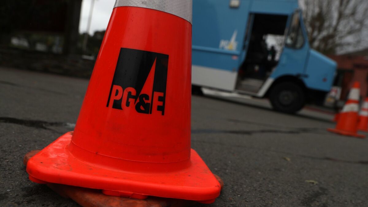 PG&E cone and truck. The utility moves toward emerging from bankruptcy 