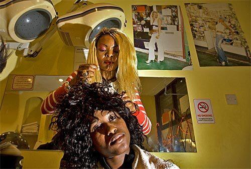 Sandra Dunn, of Nigeria, weaves a client's hair at the Looking Good Salon in Brixton, a section of London rich in African and Caribbean culture. Although travelers' guidebooks often ignore these cultural components in London, plaques and markers are popping up all over the city to commemorate the contributions of people of color, such as Jimi Hendrix, Bob Marley and poet Phillis Wheatley. Brixton Tours offers a one-hour walking tour of the area that includes food tastings and stops at neighborhood cafes, bakeries, galleries, jazz pubs, parks, historic churches, libraries and market stalls.