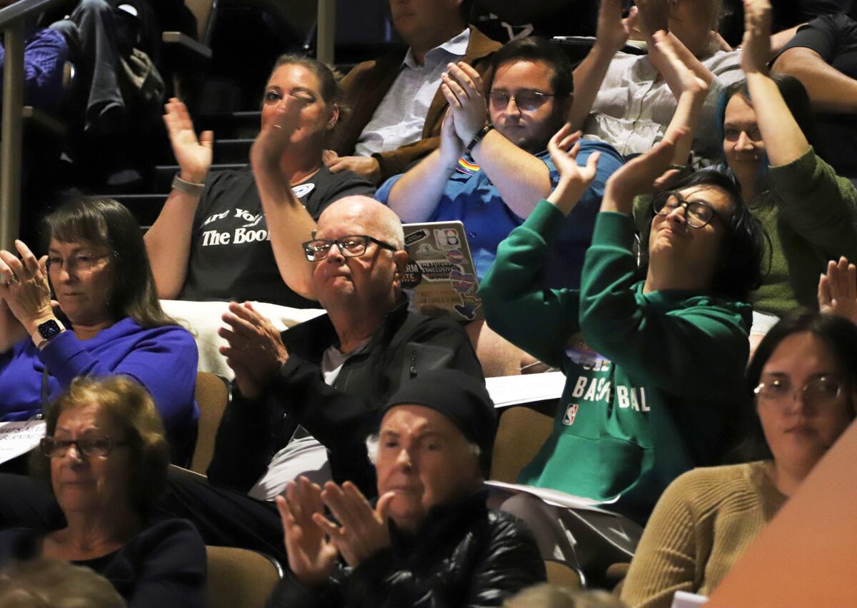 Huntington Beach residents applaud as a speaker addresses the City Council on Tuesday night.