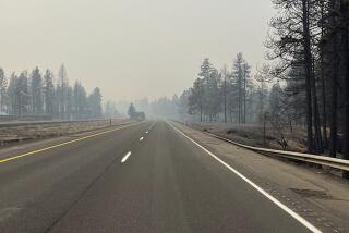 FILE - This photo provided by WSDOT East (Washington State of Transportation) smoke from wildfires fill the sky at Salnave/SR 902 interchange in Spokane County, Wash., on Saturday, Aug. 19, 2023. Authorities say a second person has died in wildfires in eastern Washington state that sparked Friday, burning hundreds of structures and closing a section of a major interstate. Fire officials said Monday, Aug. 21, a body was found in the area of the Oregon fire north of Spokane on Sunday. (WSDOT East via AP, File)