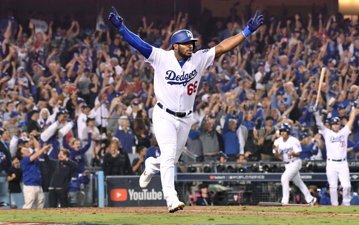 Dodgers Yasiel Puig hit a three-run home run against the Red Sox in the 6th inning in Game 4 of the World Series.