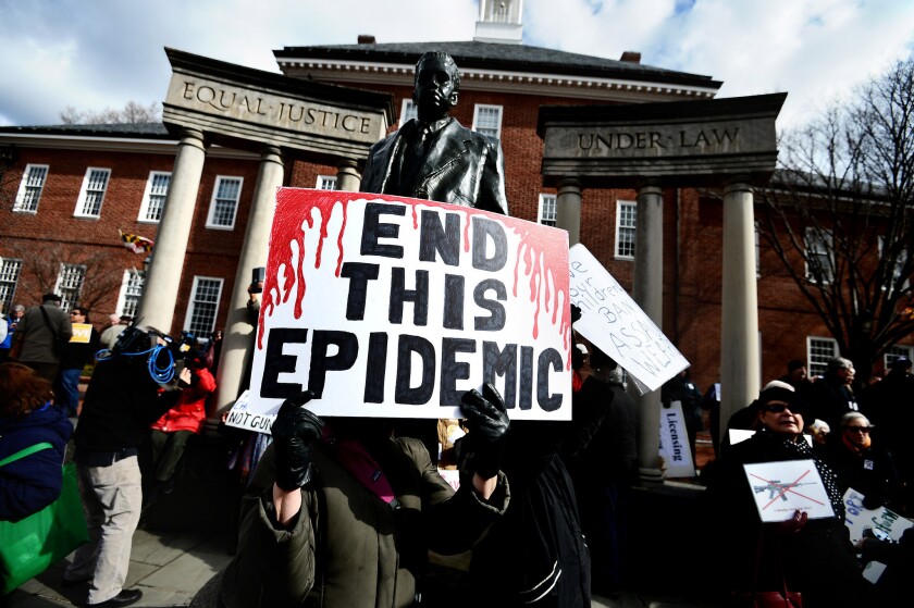 Advocates of stricter gun control laws rally at the Maryland State House.