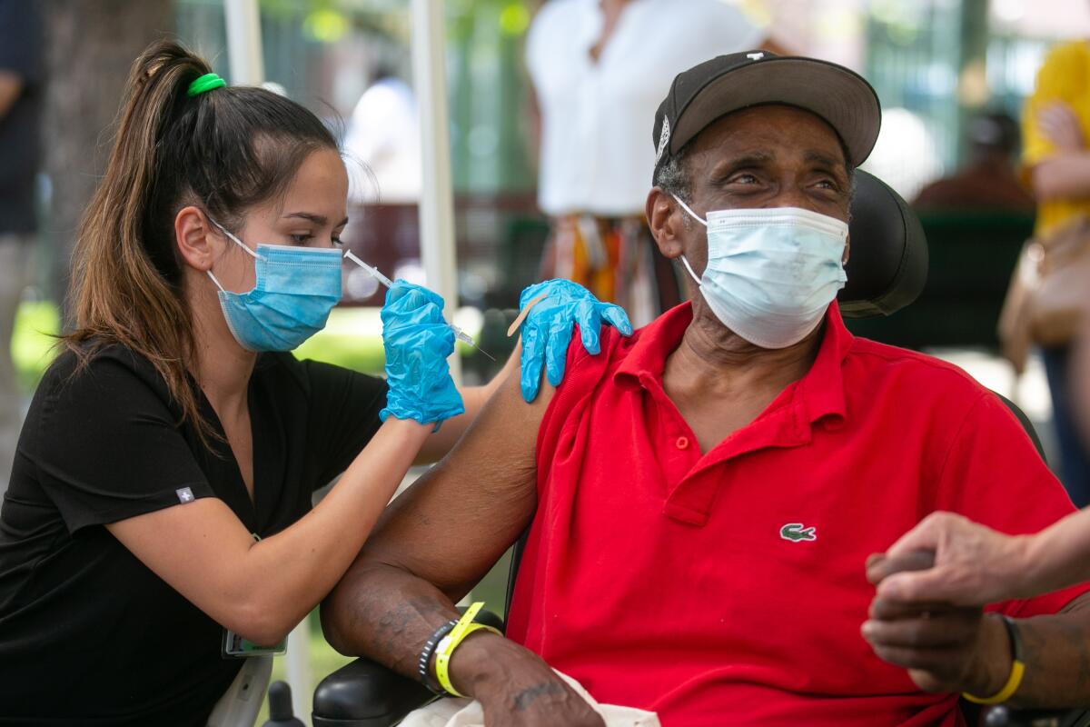 A man receives a COVID-19 vaccine.