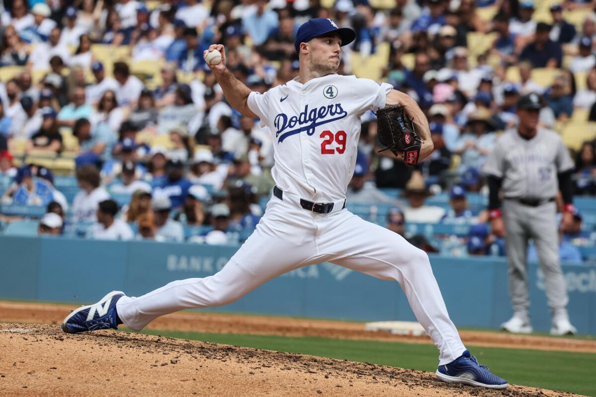 Dodgers pitcher Michael Grove delivers during the seventh inning Sunday against the Rockies.